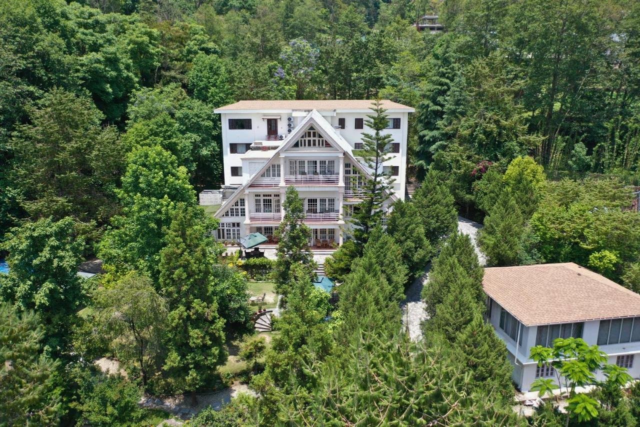 Nepal wellness retreat aerial view of Meraki Holistic Wellness center surrounded by lush forest in Budhanilkantha